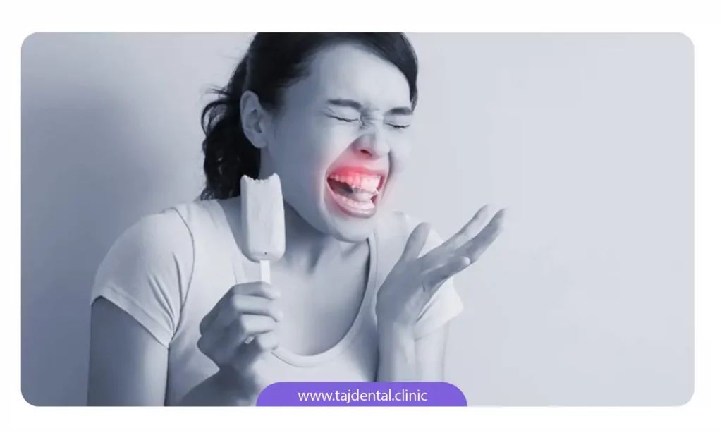 خانمی که حساسیت دندان دارد و با خوردن بستنی دندان درد گرفته است